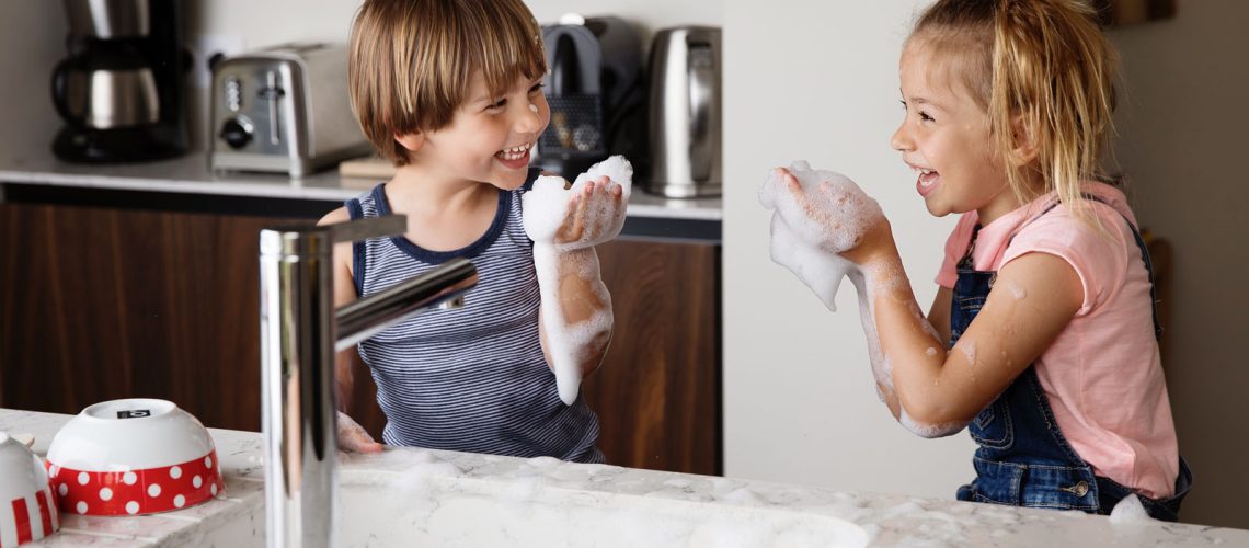 boy-girl-playing-in-sink-with-bubbles-1